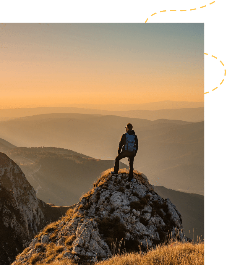 solo hiker looking out at mountain vista