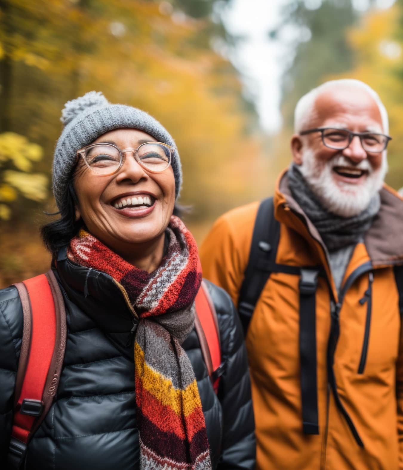 two smiling middle-aged hikers in fall weather