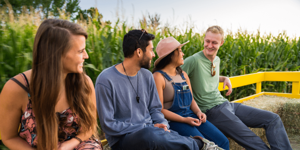 four young people on a harvest festival ride in Fremont, Colorado